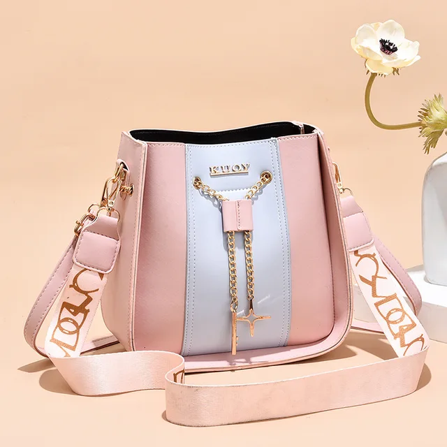 This summer, this is the bucket bag you need for beach day 🌊🏖️🐚 .  Weapons of Seduction: Quiver in Hot Sand Scale Canvas & Pink leather,  Quiver in Paris