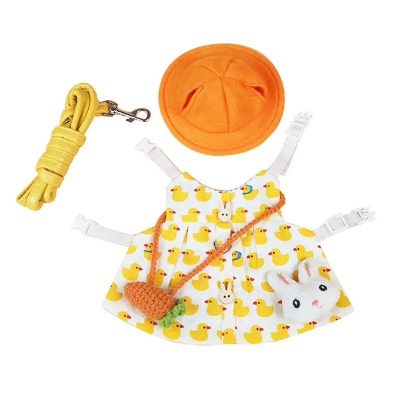 Vestido infantil con un divertido diseño de patitos amarillos y fondo blanco. El vestido tiene un lazo en la cintura y parece estar diseñado para una niña pequeña.