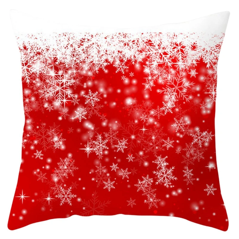 Una almohada con un diseño festivo. La almohada tiene un fondo rojo con un patrón de copos de nieve blancos y lo que parece ser brillantina o destellos, dándole un aspecto invernal y festivo. El diseño es simétrico y cubre toda la superficie de la almohada.