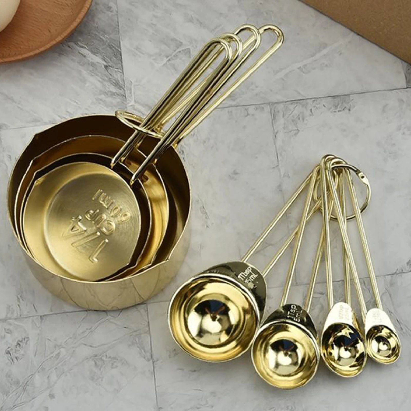 Set of 8 stainless steel measuring cups and spoons that cook with long handle