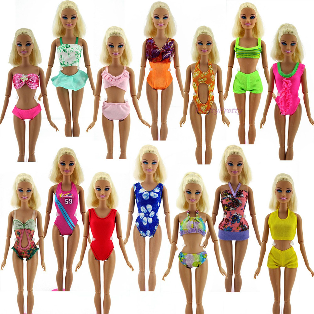 kolmteist erinevates rannariietes nukku, igaühel unikaalne värvikombinatsioon ja disain