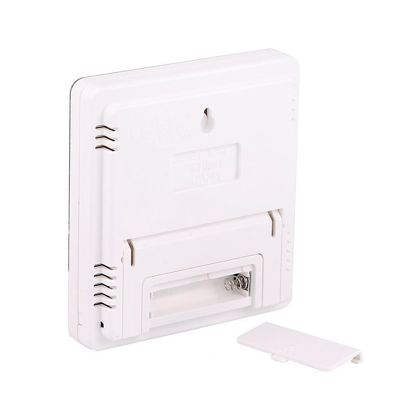 valge ruudukujuline niiskuse ja temperatuuri mõõdik tagantvaates, avatud patareipesaga