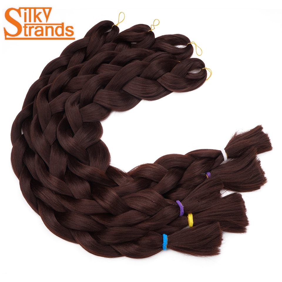 tumedad punutud sünteetilised juuksepikendused