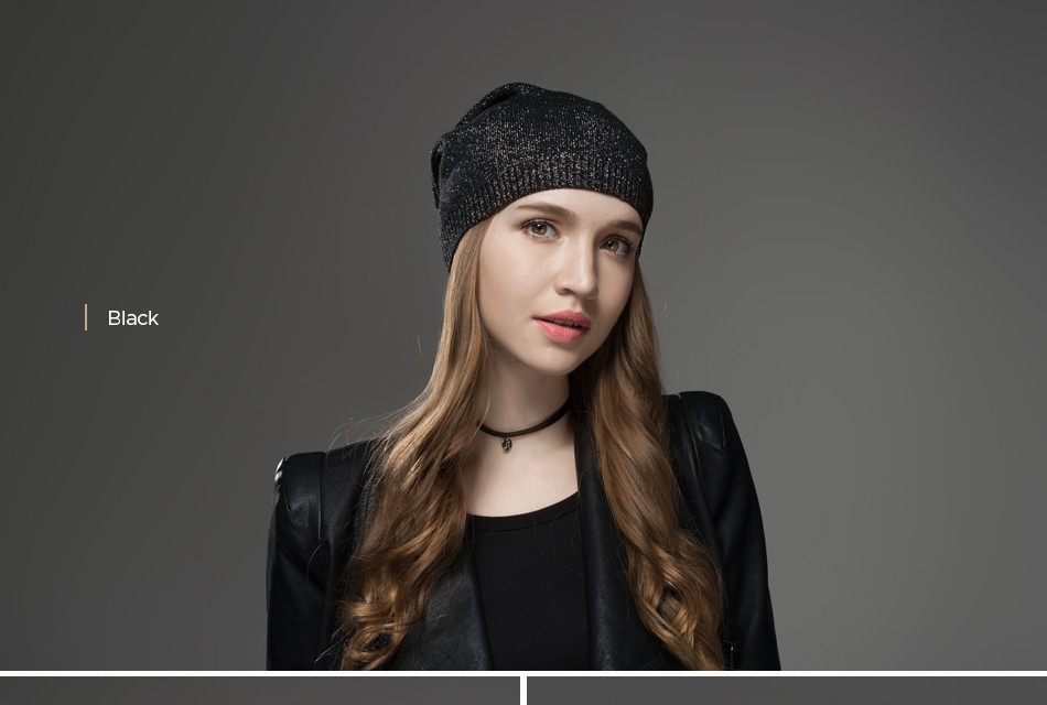 naine kannab musta sädelevat mütsi ja musta jakki