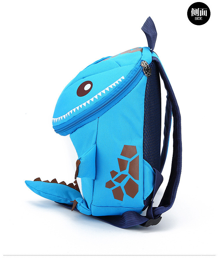 sinine dinosauruse kujuline seljakott laste jaoks, millel on pruunid detailid ja mustad rihmad