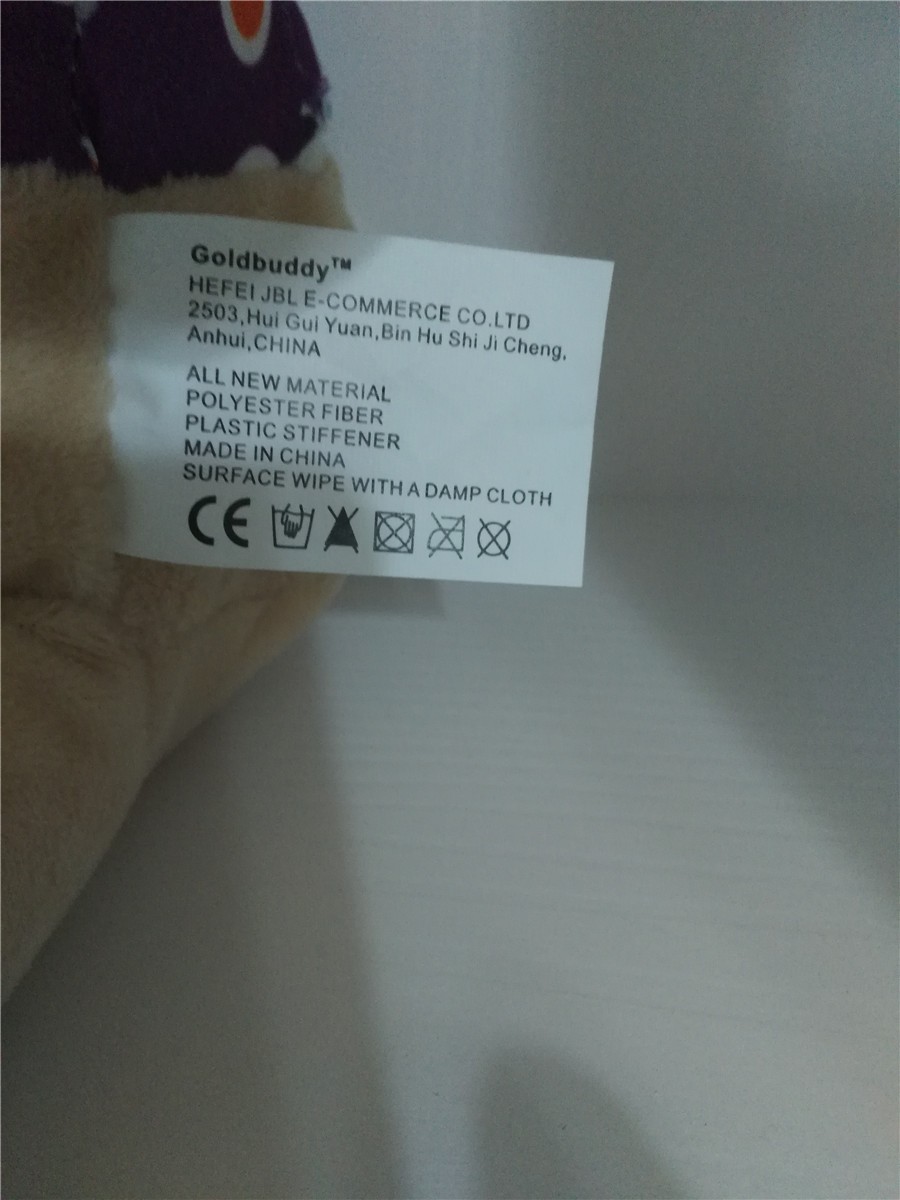 pehme mänguasja etikett, millel on tootja andmed ja hooldusjuhised