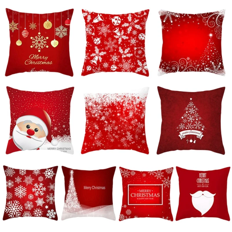 Una colección de cojines decorativos con temática navideña. Cada almohada presenta un diseño diferente, que incluye copos de nieve, árboles de Navidad, Papá Noel y otros elementos festivos. Los colores son predominantemente el rojo y el blanco, que son colores tradicionales asociados con la Navidad.