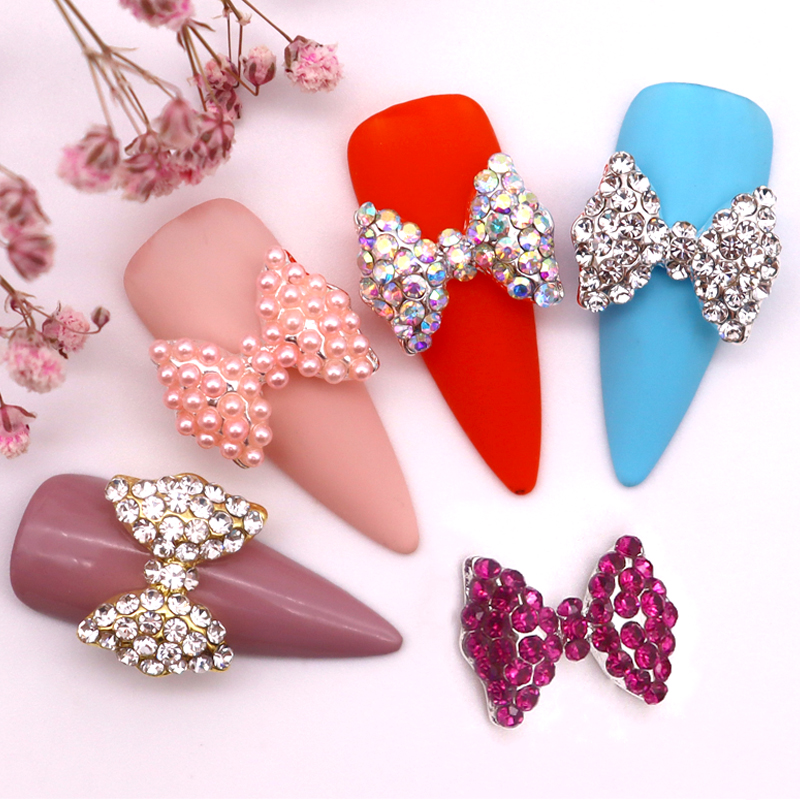 Best of 10pcs / bag Charm 3D Metal Manicure Nail Art Decoration Golden Silver Bow Tie Bowknot Inlaid Rhinestone Pearl DIY Nail Accessories Reviews & Tips