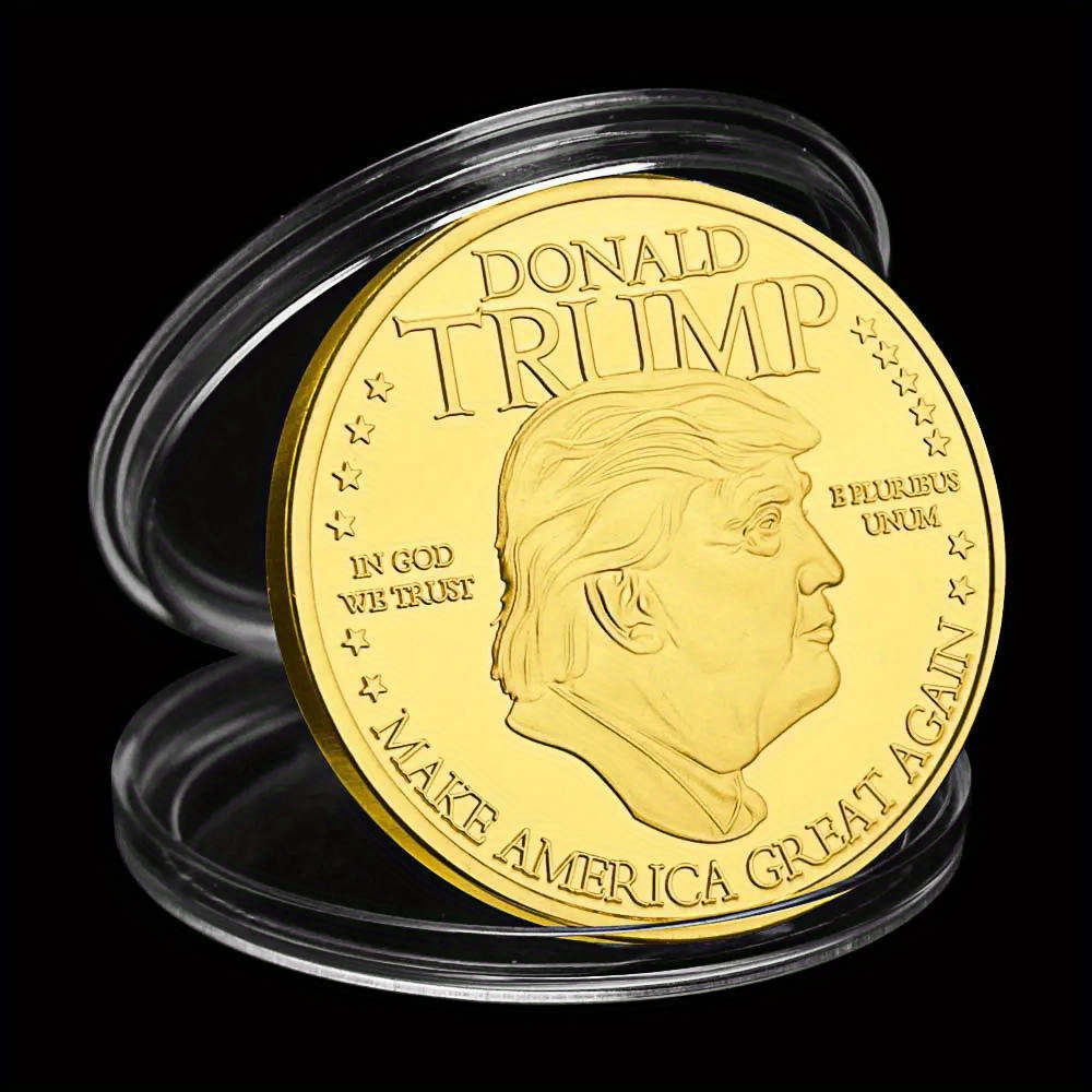 Shiny trump gold coin collectible encased in protective cover.