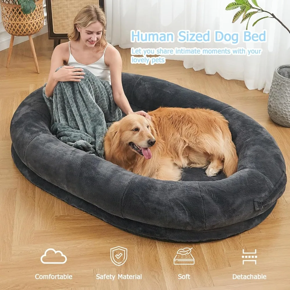 A woman and her dog laying in a cozy dog bed.