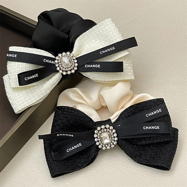 Large satin cheer bow with dense rhinestones