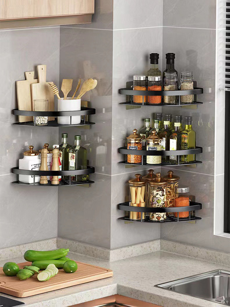 Black bathroom corner shelves holding toiletries in kitchen setup