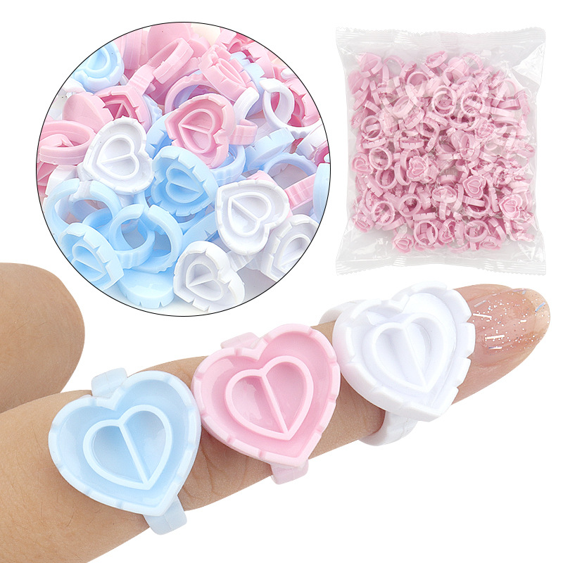 Best of Glue Rings Disposable 100pcs New Heart Shape Eyelash Extension Finger Holder Rings Cup For Eyelashes Extension Tattoo Pigment Reviews & Tips