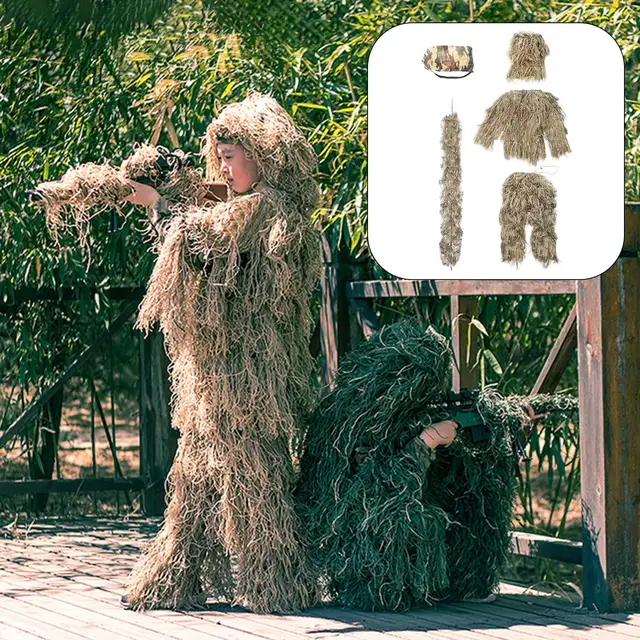 Camouflage Wildlife Photographer In The Ghillie Suit Working In The Wild  Stock Photo, Picture and Royalty Free Image. Image 87486694.