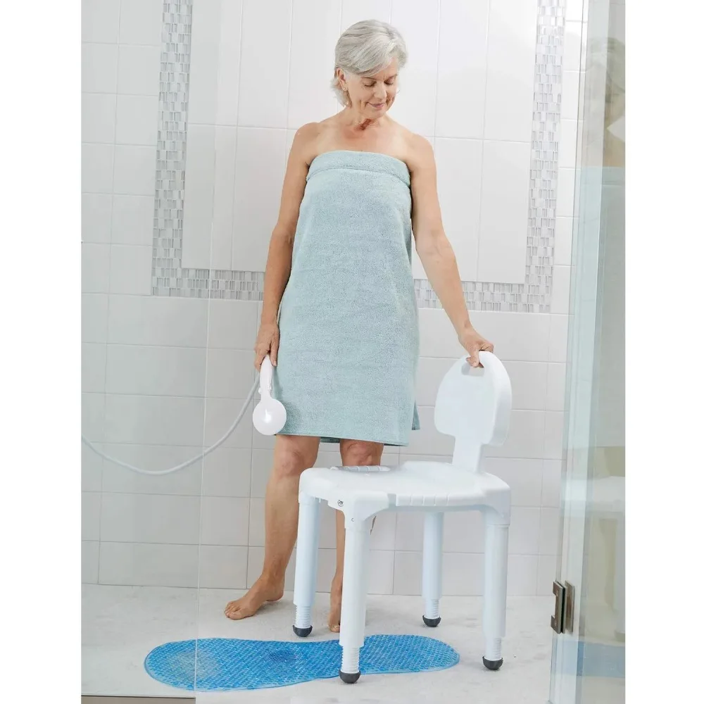 An elderly woman in a bathrobe standing next to a slip-resistant shower chair.