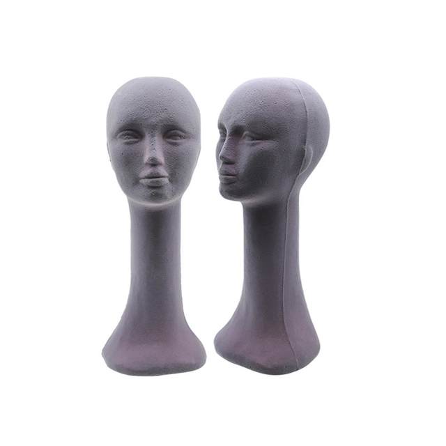 Female mannequin head in black pvc