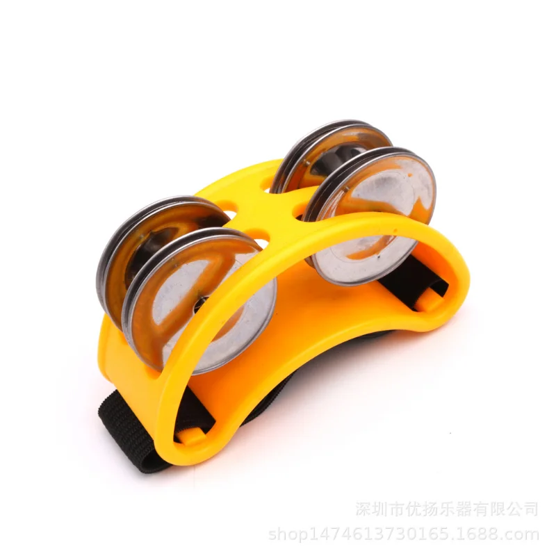 yellow elliptical hand foot tambourine
