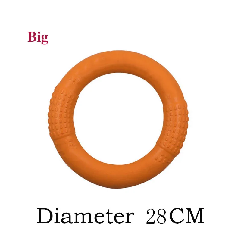 Un gran anillo naranja con una superficie texturizada. El anillo parece estar hecho de un material similar al caucho, posiblemente para usarse como agarre o soporte. El texto de la imagen indica que el diámetro del anillo es de 28 centímetros.