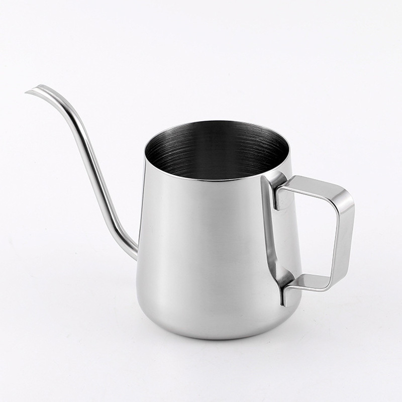 The 304 Stainless Steel Milk Cup, part of the High-Quality Coffee House Essential Set, is a stylish coffee accessory with a curved spout perfect for pouring. Set against a plain white background, it highlights a large handle on the right side for ease of use.