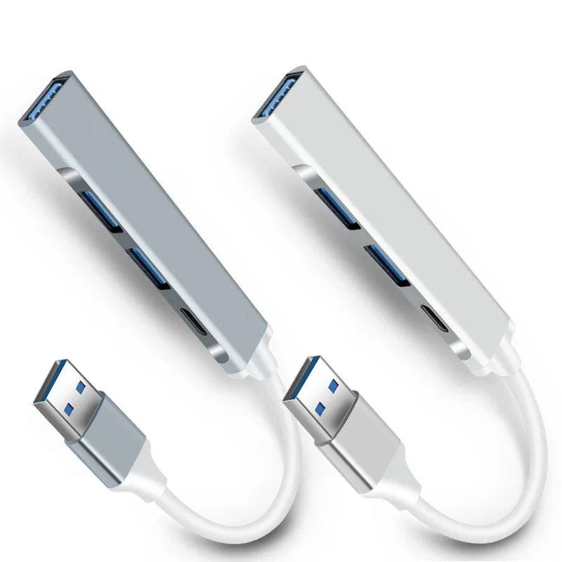 Dos cables USB blancos están conectados a una computadora