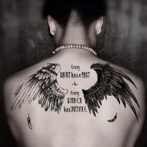 skull wings back tattoo