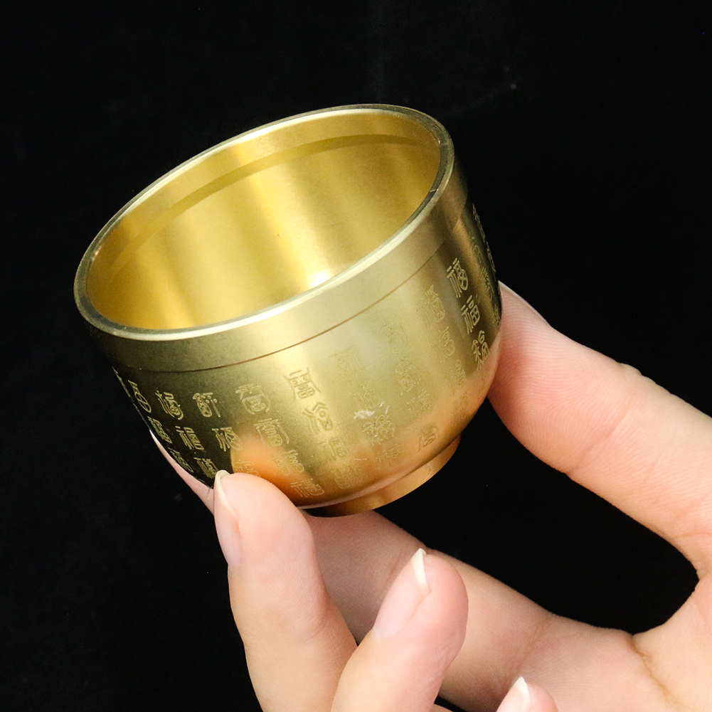 Brass treasure bowl with Baifu engravings used for feng shui, altar offering, and home decor to attract luck and prosperity